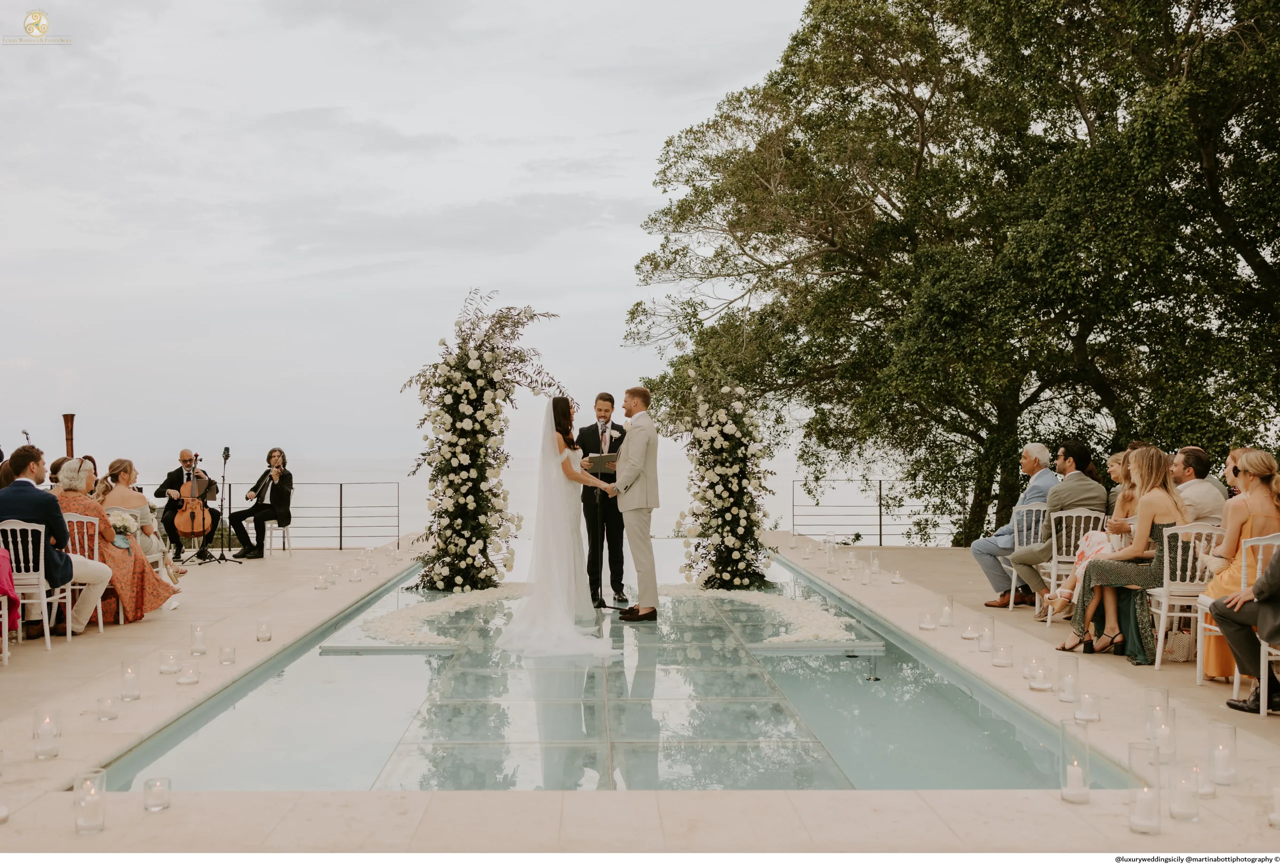 Portfolio 605 ceremony vows astonish amazing view italy siciliy taormina villa venue sea ocean views intifinty stage pool flowers wedding planner decor design